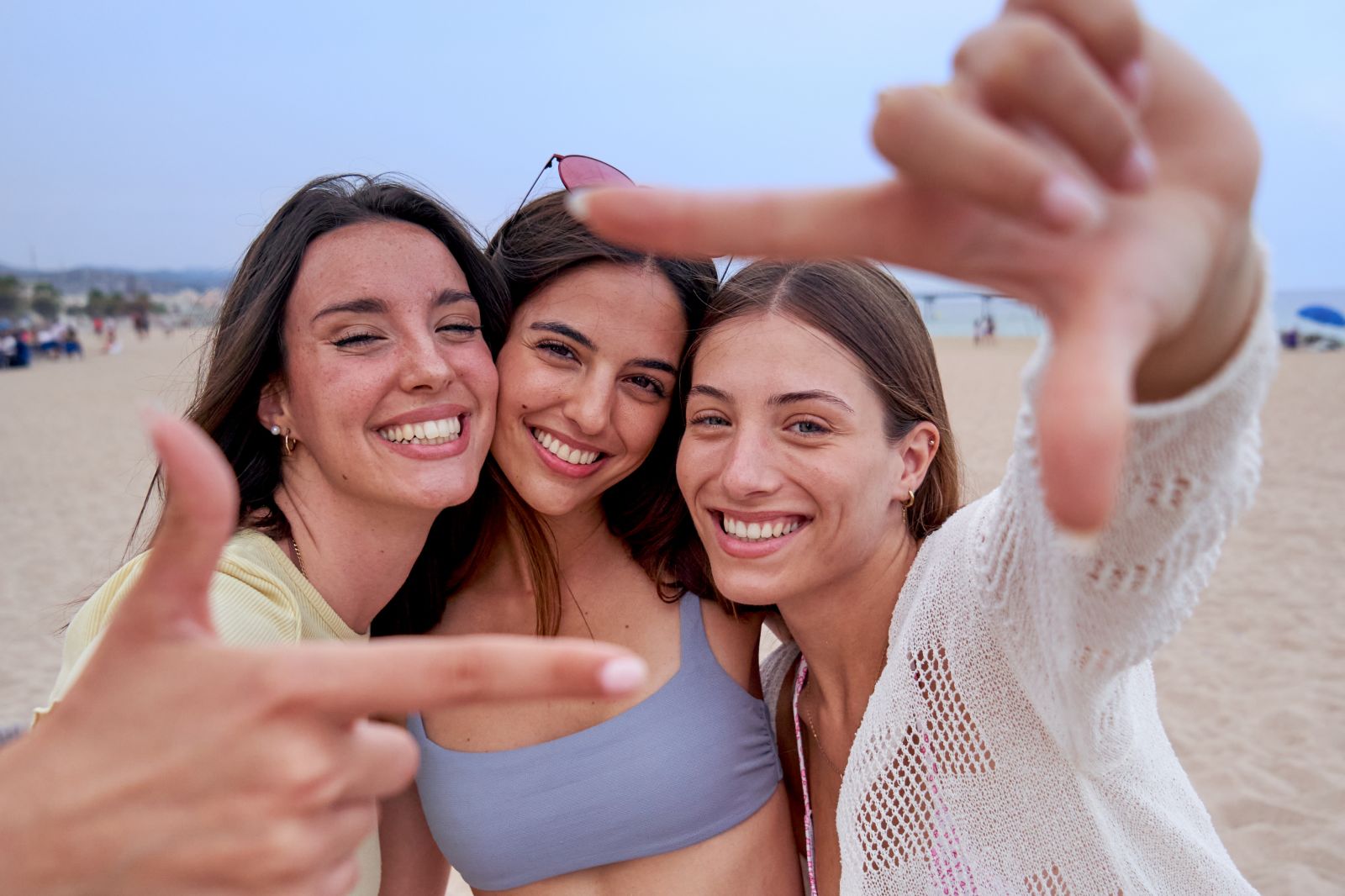 three girls smiling for selfie on beach the crossings sacramento